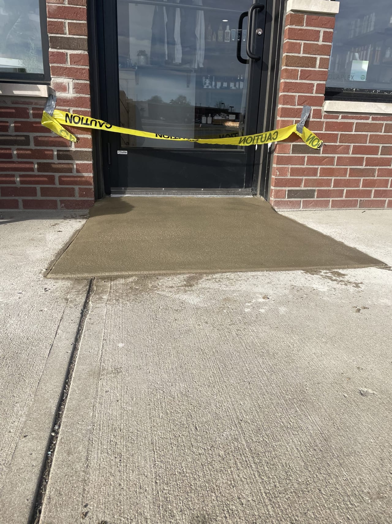 Concrete storefront entrance threshold pad, Pendleton Indiana