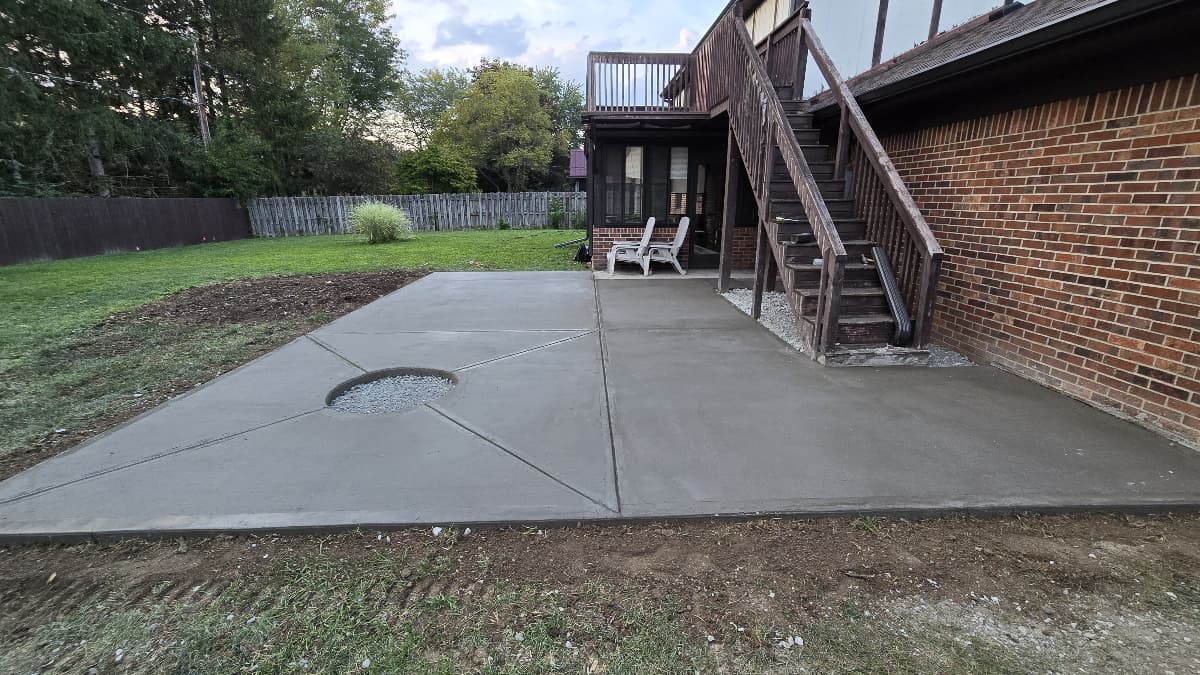 Backyard concrete patio with built-in planter cutout, Westfield Indiana