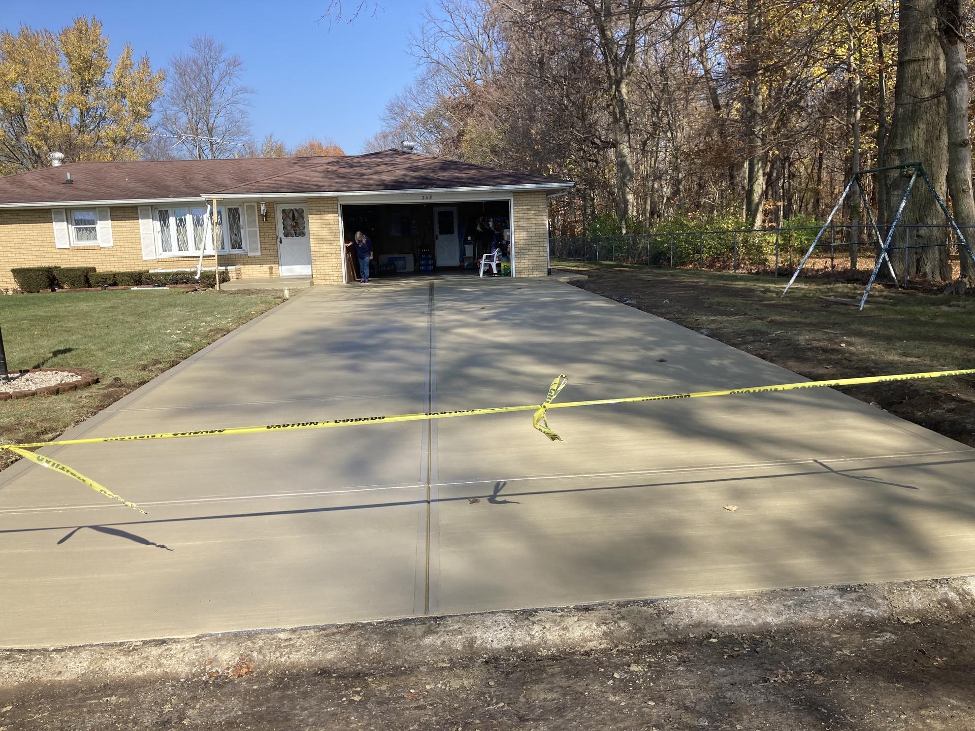 Completed residential driveway with caution tape, Anderson Indiana