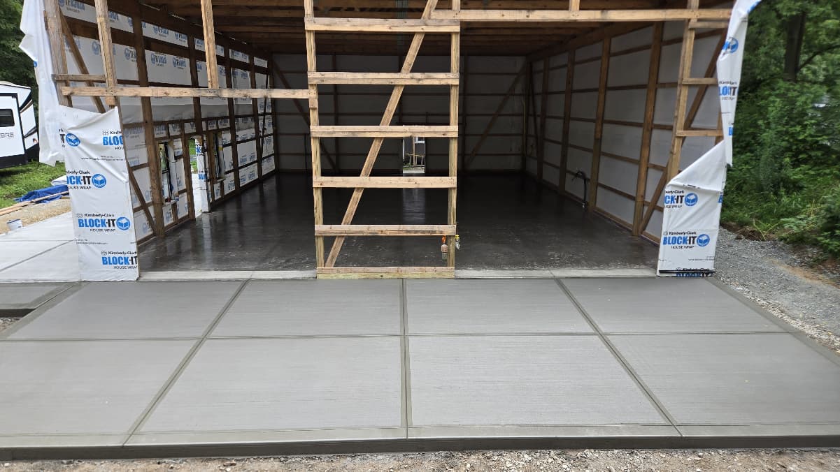 Broom-finished concrete apron at pole barn entry with control joints, Madison County Indiana