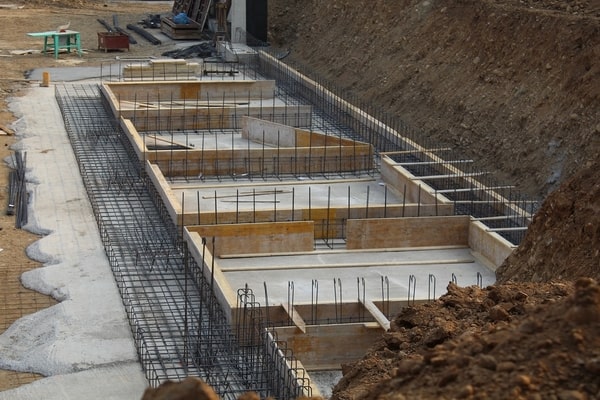 Uniform concrete forms with rebar, construction site