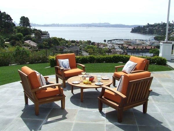 Patio furniture with dinner served overlooking the beach with stamped concrete